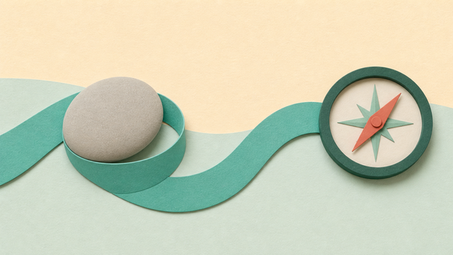 Smooth green path curving past a grounding stone toward a compass.