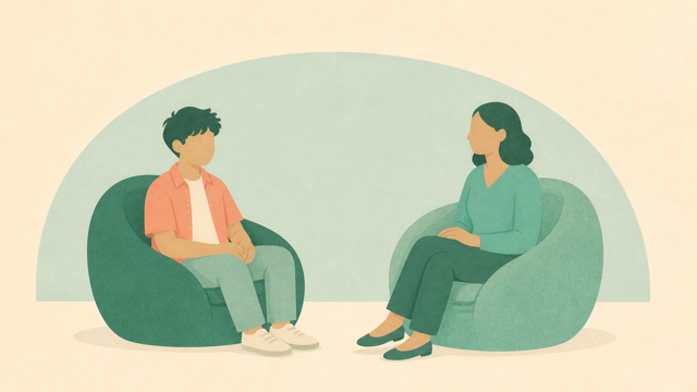 Teen and therapist seated across from one another in a calm counseling room.