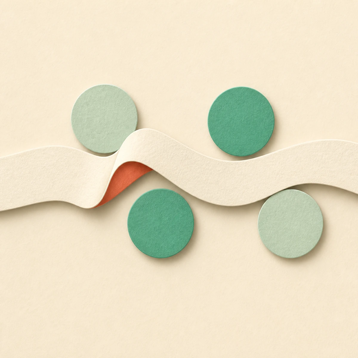 Cream paper ribbon weaving past four green felt circles on a warm sand background, with a coral fold beneath the wave — abstract paper-cut composition