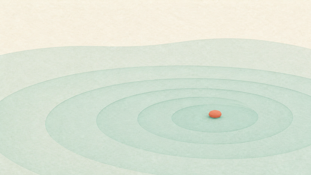 Small coral point centered in expanding pale green rings.