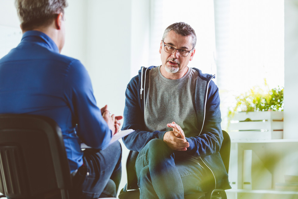 Therapist talking with a client during a psychotherapy session